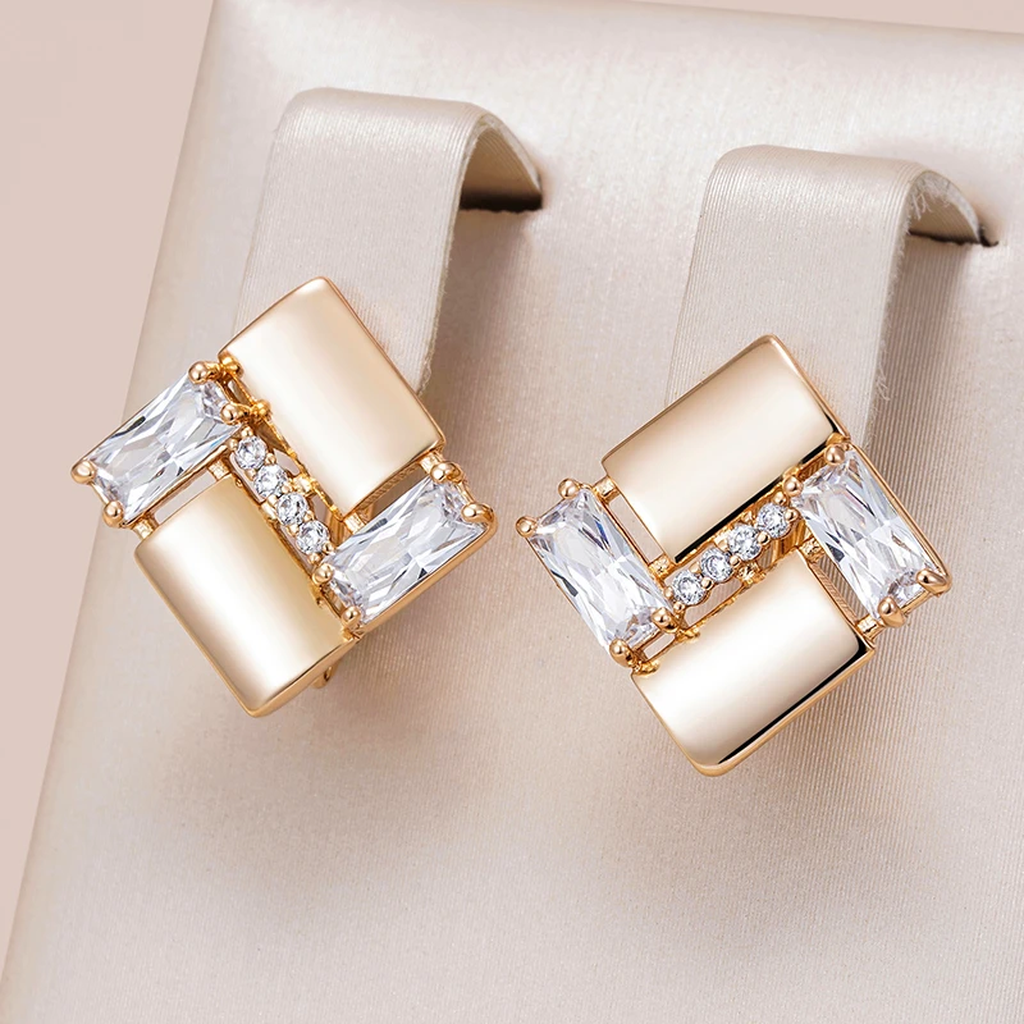 Boucles d’oreilles géométriques élégantes dorées à zircons