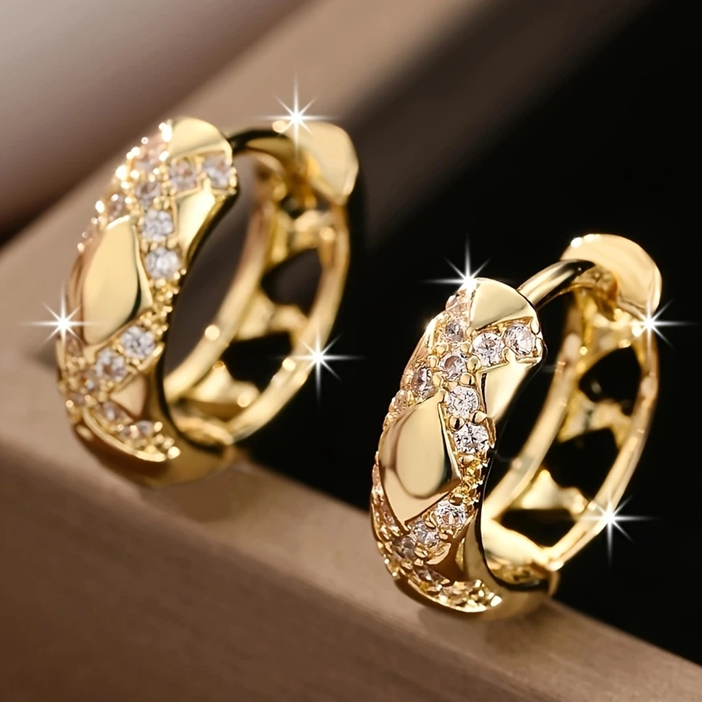 Boucles d’oreilles pendantes dorées à motif ajouré