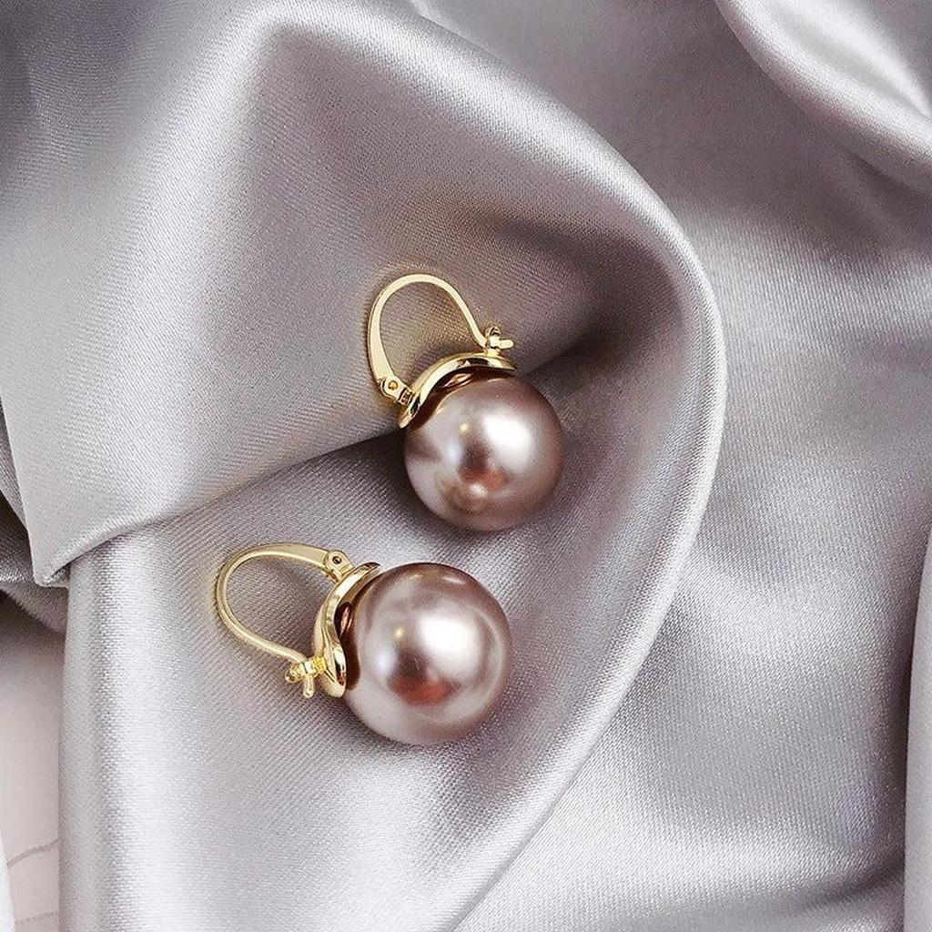 Grandes boucles d’oreilles dorées à marguerites