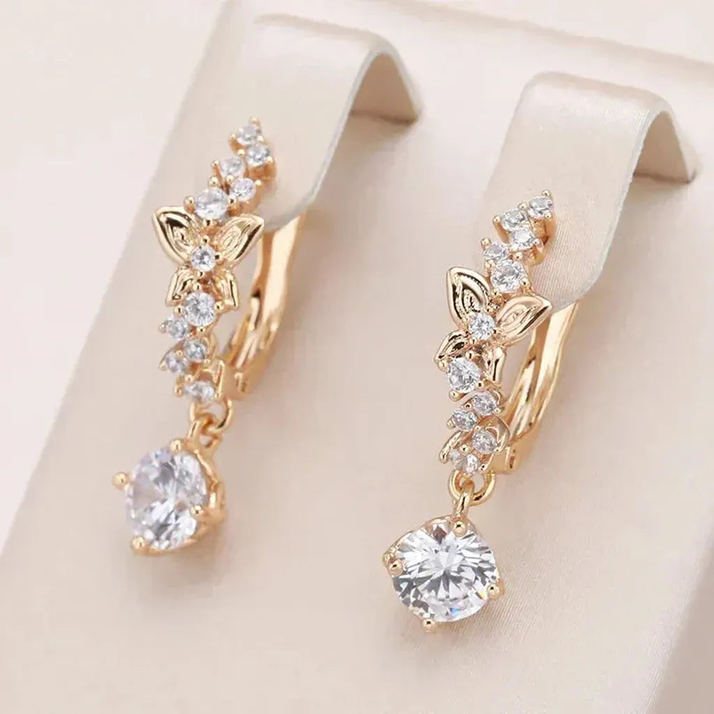 Boucles d’oreilles pendantes dorées à zircons