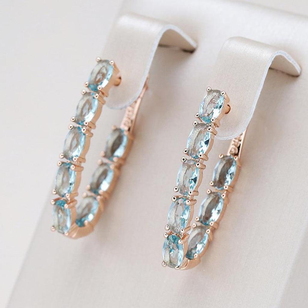 Boucles d’oreilles pendantes turquoise et zircons | Doré