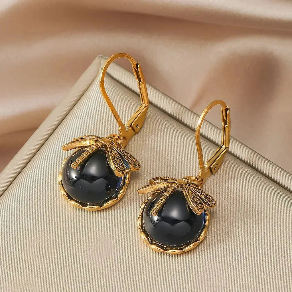 Boucles d’oreilles rondes effet or blanc vieilli