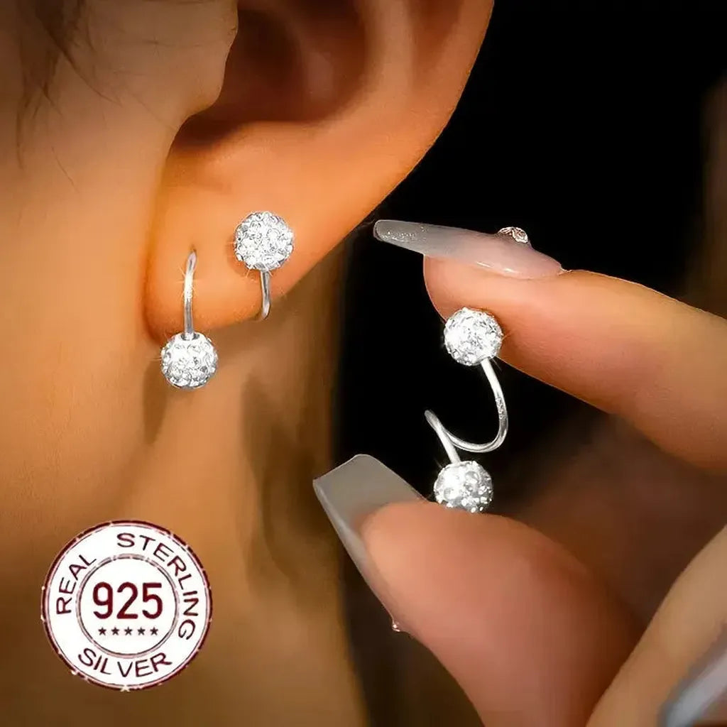 Boucles d’oreilles à double spirale et zircons