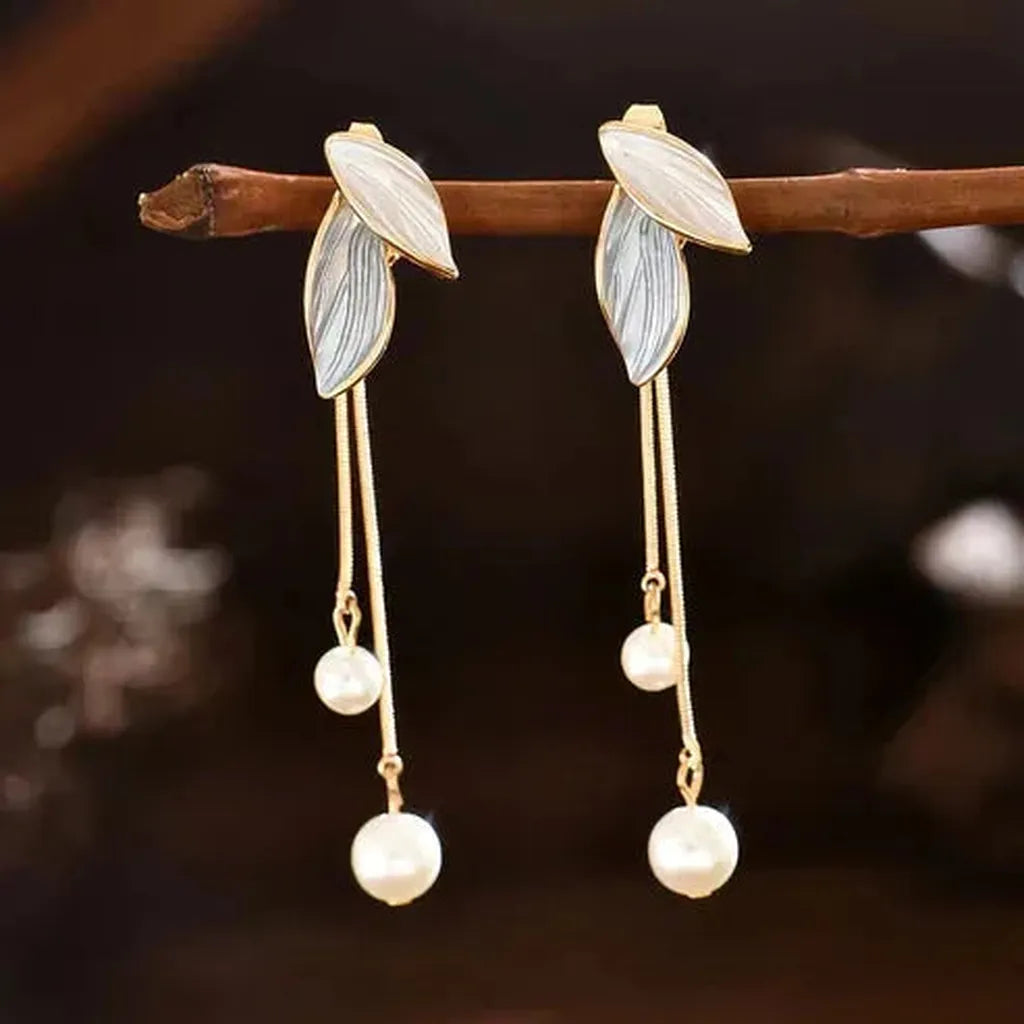 Boucles d’oreilles en forme de feuille à marguerites