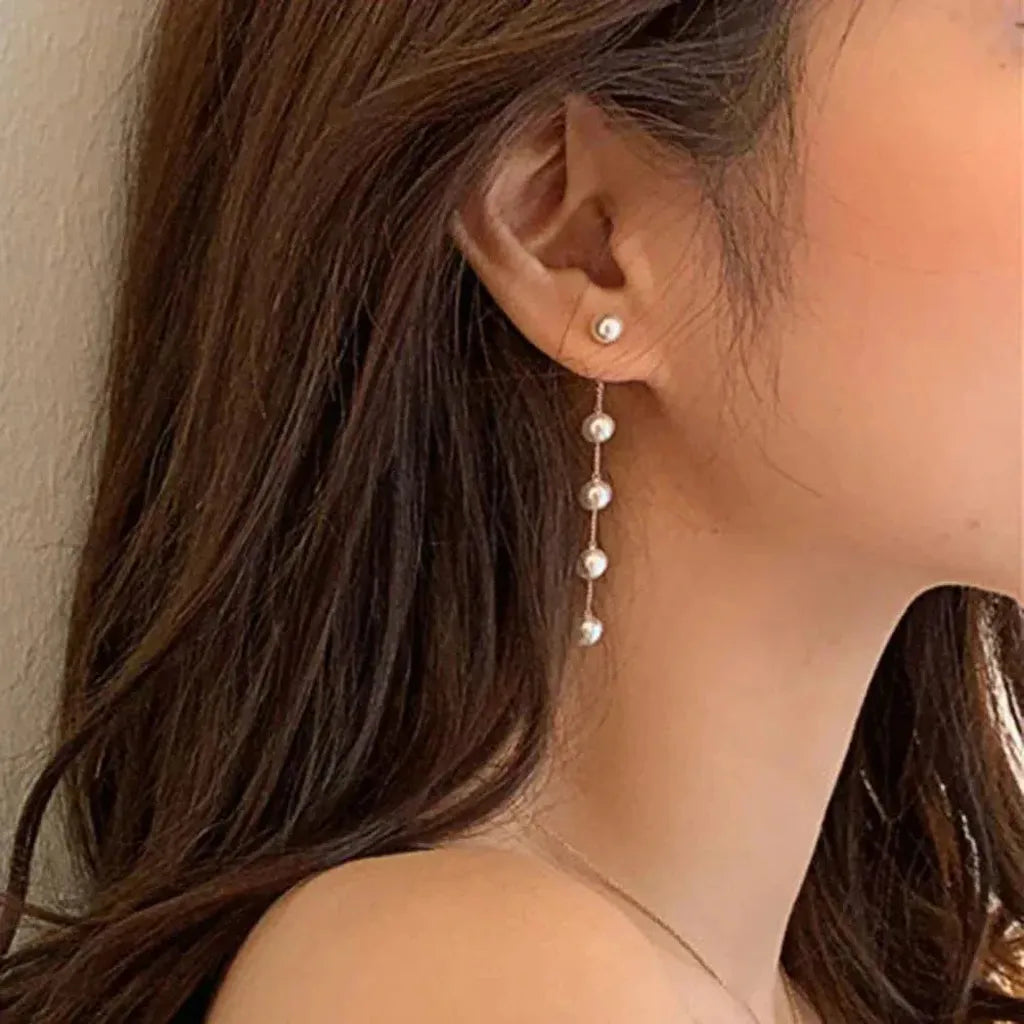 Boucles d’oreilles marguerites pendantes