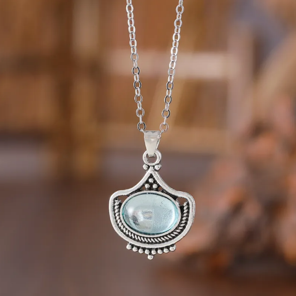 Parure rétro — Collier et boucles d’oreilles aux pierres ovales bleues