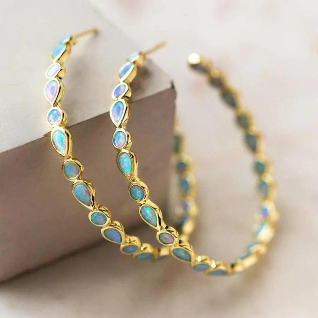 Boucles d’oreilles rétro dorées à opale bleue