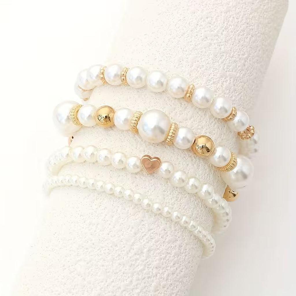 Lot de bracelets à perles blanches