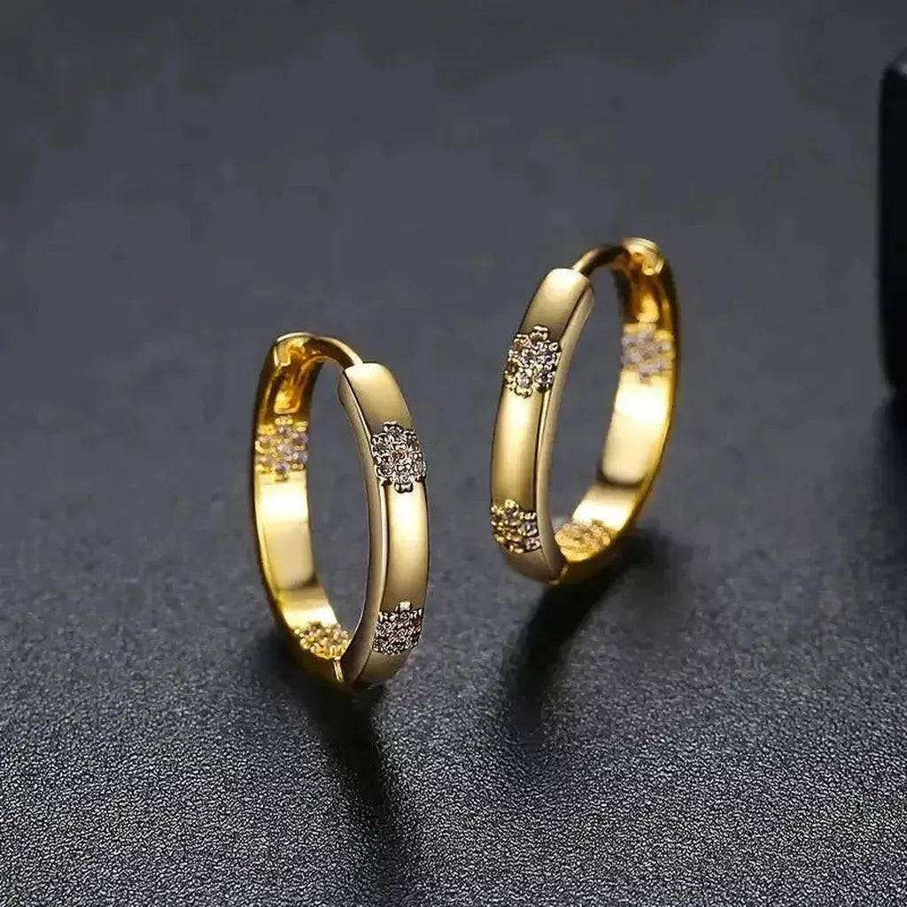 Boucles d’oreilles vintage roue et fleur dorée